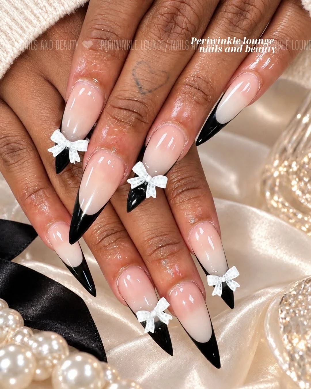 Bow French nail art at Periwinkle Lounge
